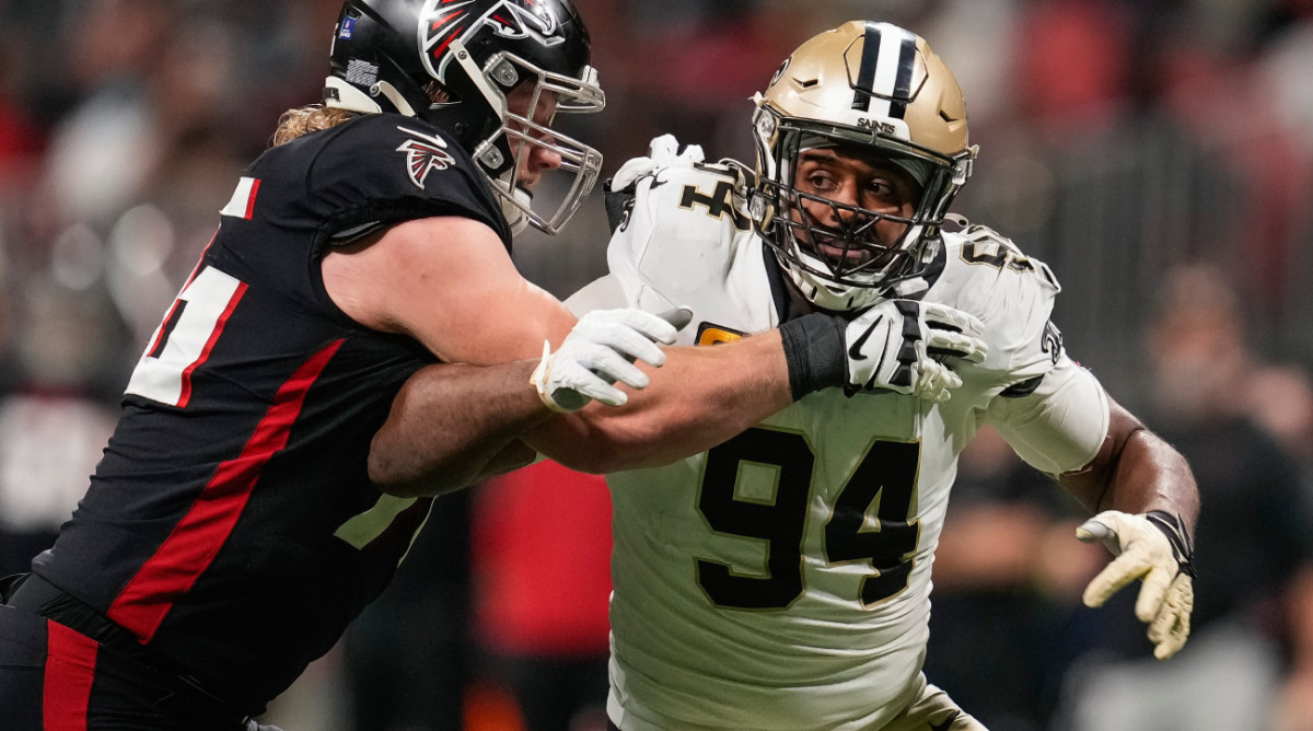 Jan 9, 2022; Atlanta, Georgia, USA; New Orleans Saints defensive end Cameron Jordan (94) tries to rush the passer blocked by Atlanta Falcons offensive tackle Kaleb McGary (76) during the second half at Mercedes-Benz Stadium. Mandatory Credit: Dale Zanine-USA TODAY Sports